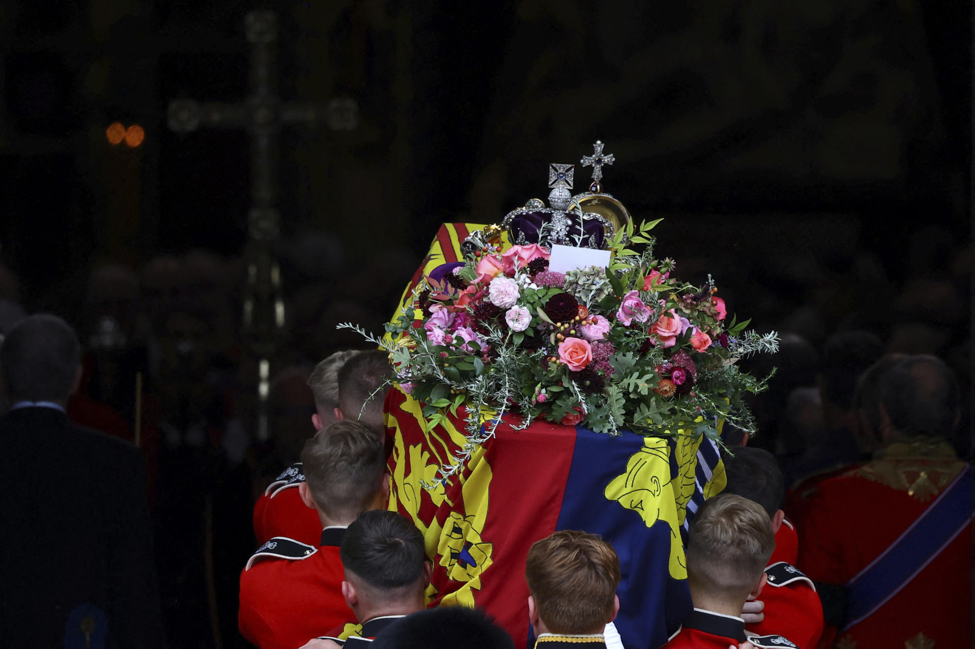 The coffin of Britain's Queen Elizabeth is carried into the Westminster Abbey, during her funeral in London Monday, Sept. 19, 2022. (Hannah McKay/Pool Photo via AP)